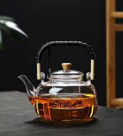 Steaming Glass Teapot and Boiling Tea Kettle